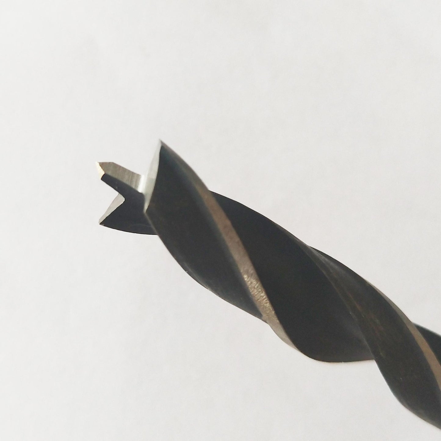 7mm brad point drill bit tip close-up