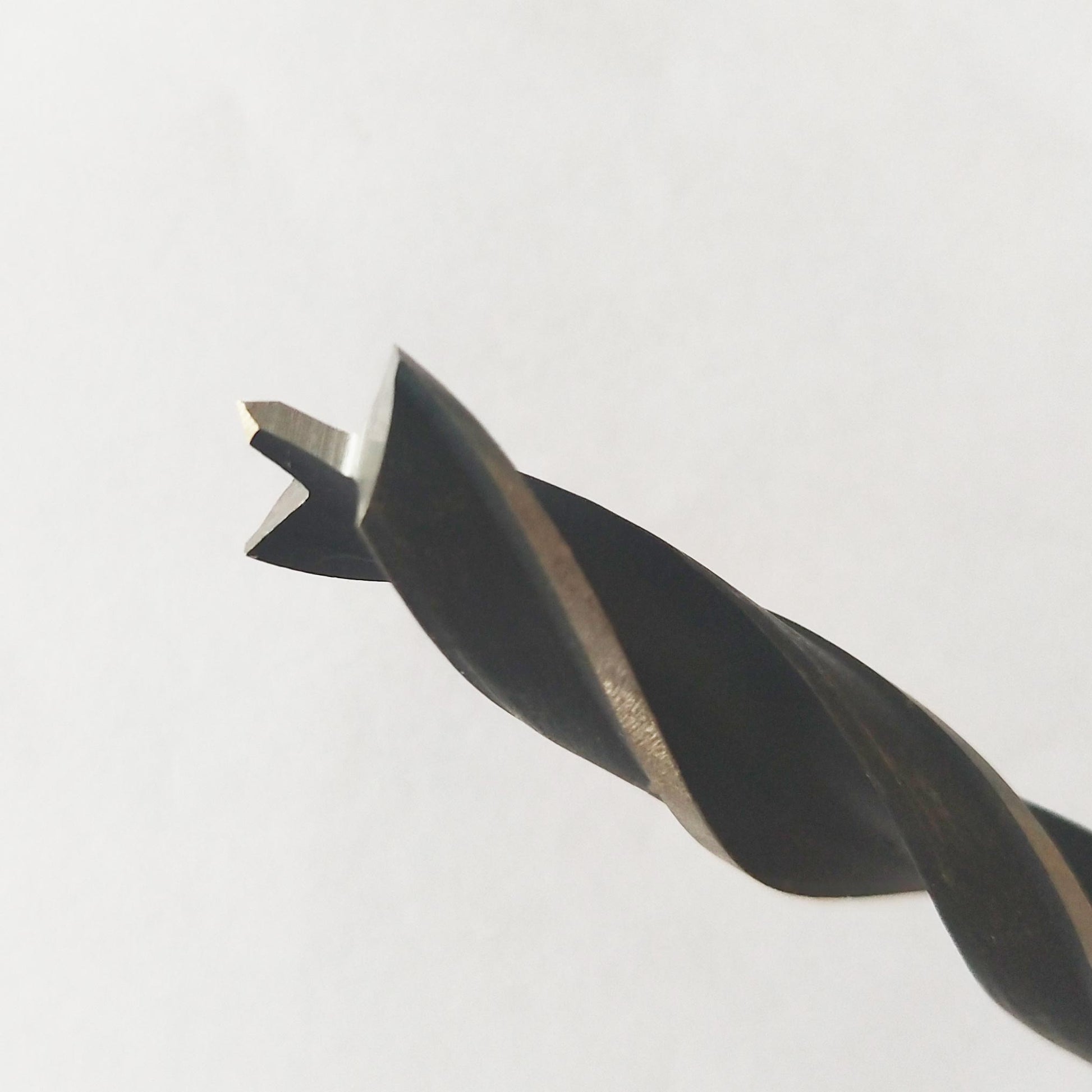 7mm brad point drill bit tip close-up