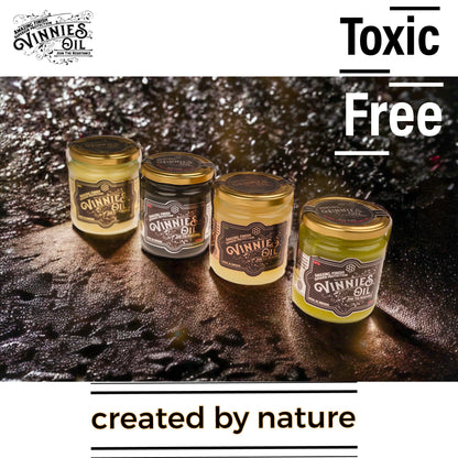 Four jars of Vinnie's Oil on a textured surface with 'Toxic Free' and 'Created by Nature' text.