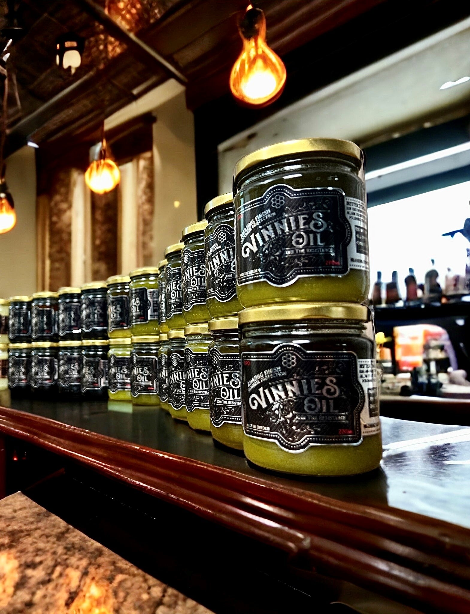 Vinnies Oil UPO and UPO Dark Stacked on Wooden Bar