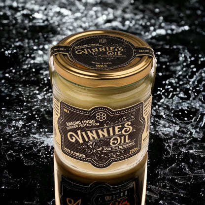 Jar of Vinnies Oil Hard Wax on a dark textured water splash background